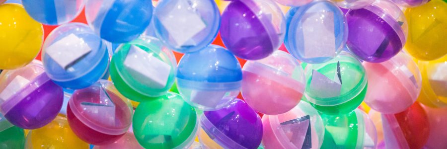 A colorful assortment of Japanese capsule toys (gachapon) displayed in vending machines, representing the growing capsule toy market in Japan in 2025.